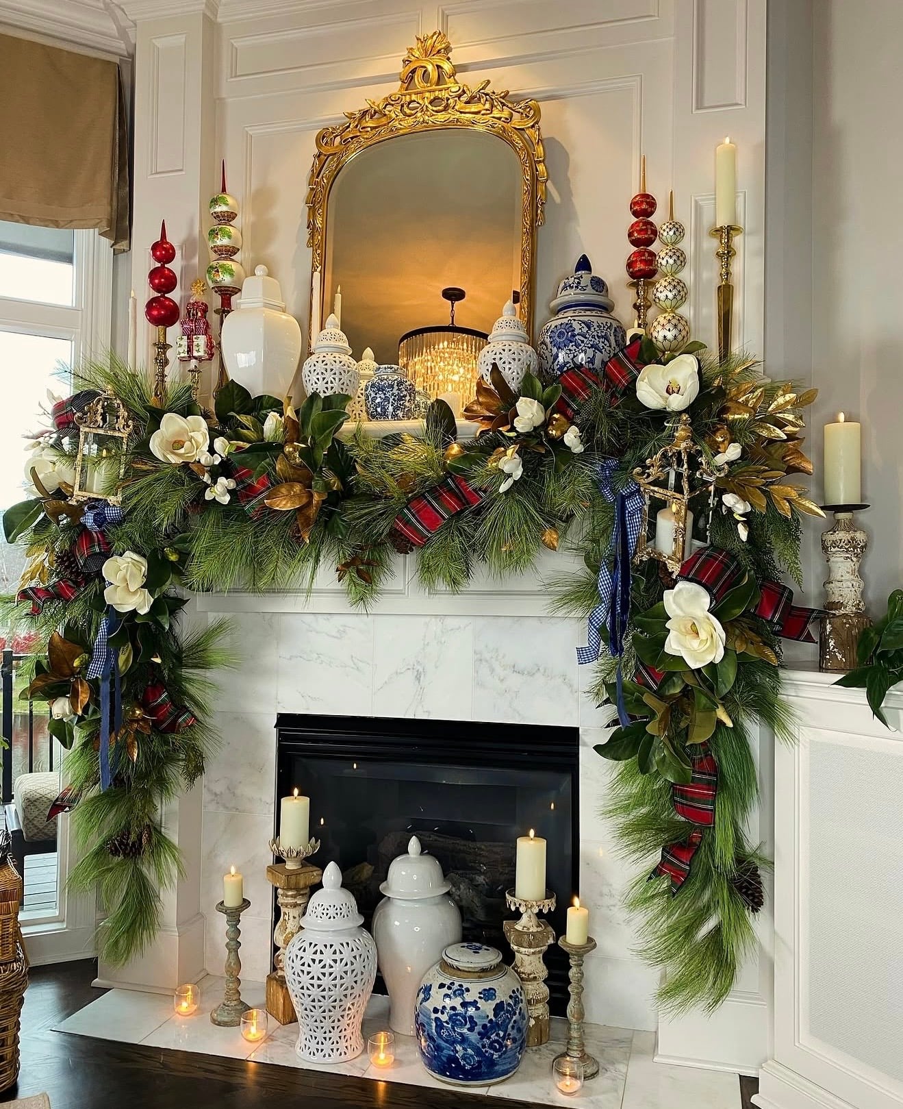 Ralph Lauren-style holiday mantel with traditional greenery, layered textures, and blue porcelain dishes with plaid ribbon