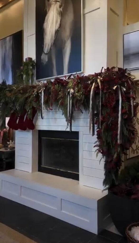 Ralph Lauren-style Christmas mantel with classic greenery, layered textures, and timeless holiday accents and horse portrait