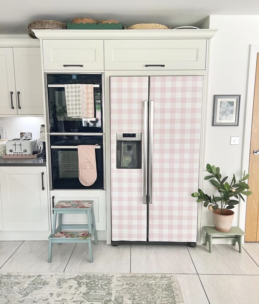 Refrigerator wallpaper makeover showing a decorative pattern of pink plaid for seasonal kitchen styling.