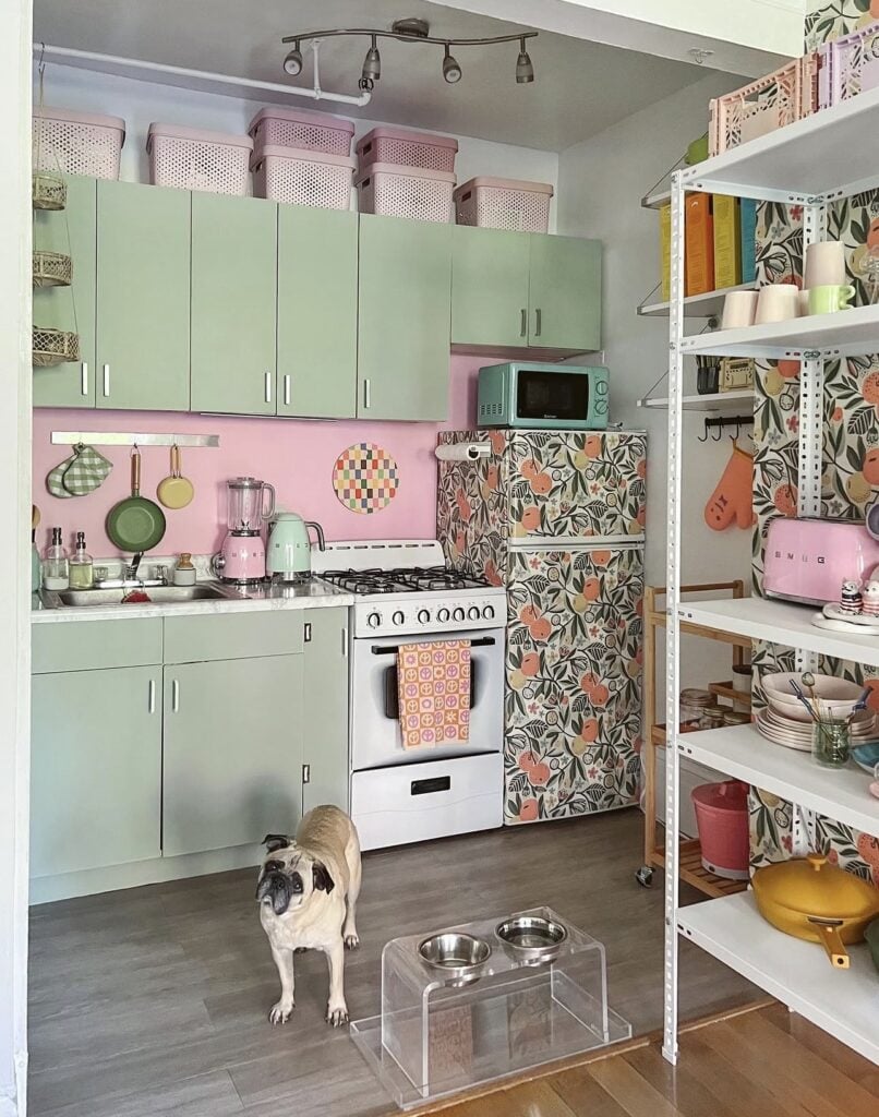 Refrigerator decorated with patterned wallpaper to personalize a rental kitchen.
