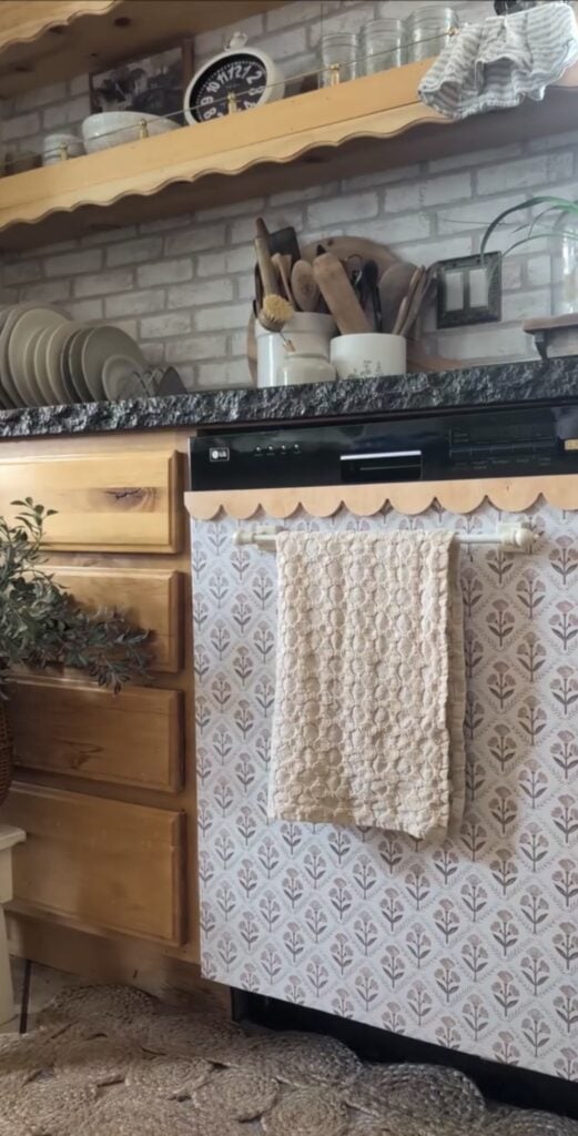 Dishwasher decorated with patterned wallpaper as a creative kitchen appliance makeover.