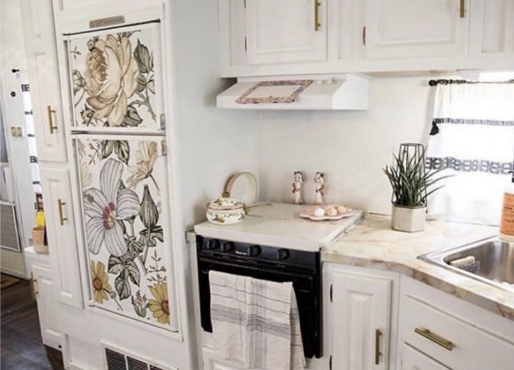 Wallpapered refrigerator positioned flush with the surrounding wall for a coordinated kitchen design.