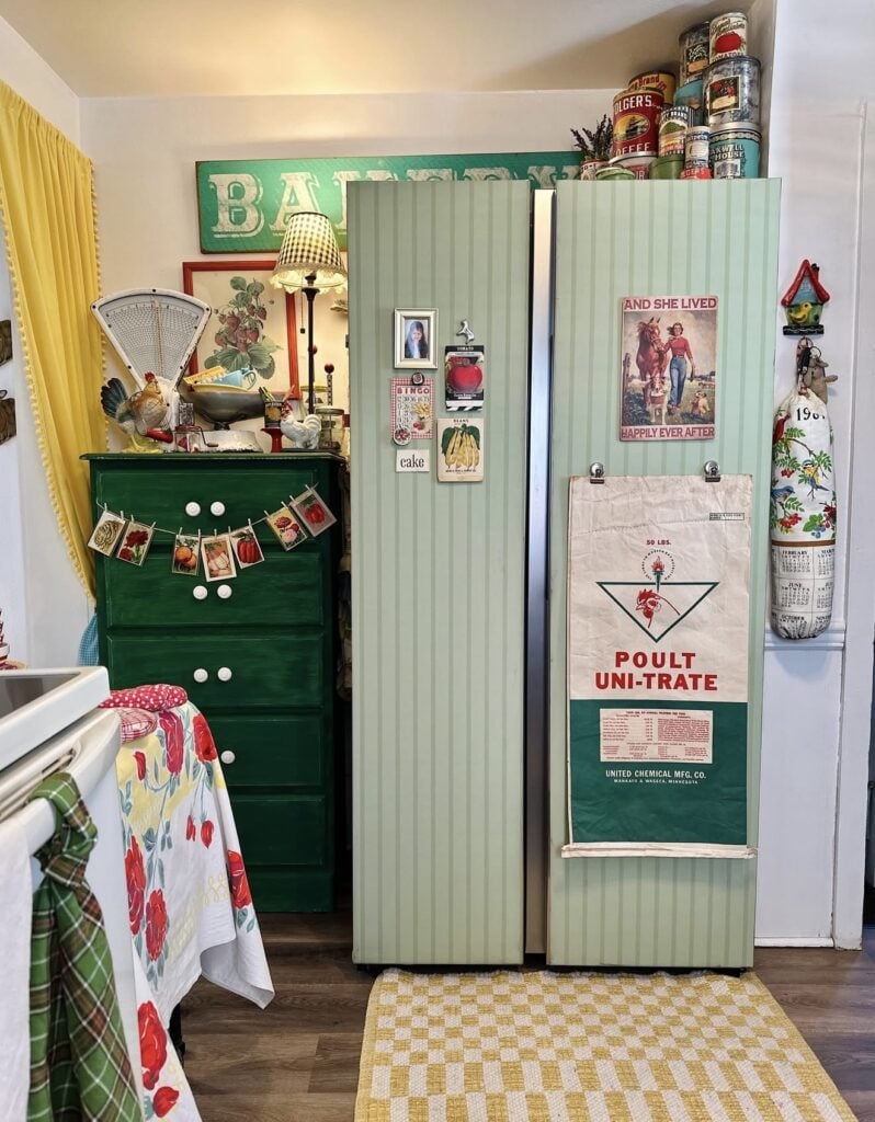 Refrigerator decorated with green striped wallpaper for a colorful kitchen makeover.